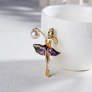Elegant dancing ballerina brooch with purple enamel pearls and rhinestones on gold metal