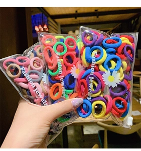 Close-up of colorful high-elasticity hair ties in a transparent zipper packaging bag