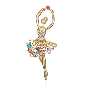 Close-up of dancing ballerina brooch with colorful rhinestones and gold-tone finish