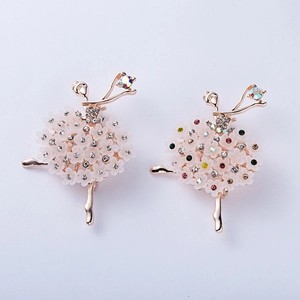 Detailed close-up of dancing girl brooches with rose gold finish and colorful rhinestones