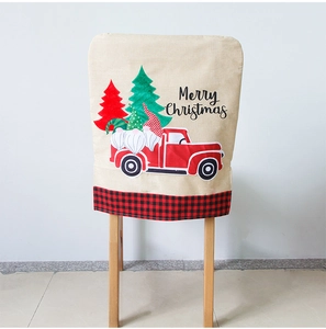 Detail of Christmas chair cover with gnome, red truck pattern and Merry Christmas text