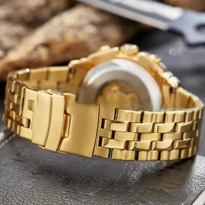 Detailed close-up of golden stainless steel watch band with secure folding clasp closure