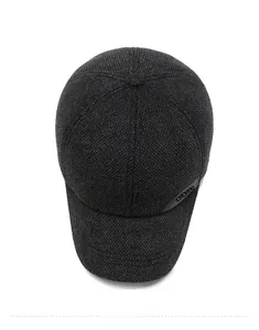 Top view of men's winter baseball cap showing dark grey knitted fabric and thick texture