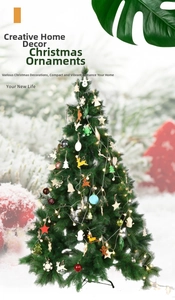 Detail of wooden Christmas ornaments featuring snowflakes and reindeer on a tree