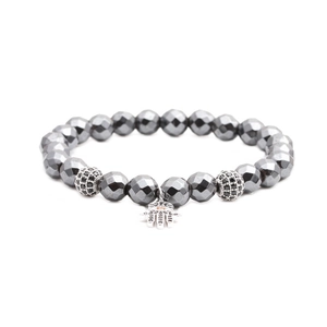 Faceted hematite beaded bracelet with silver Hamsa hand charm and crystal spacers