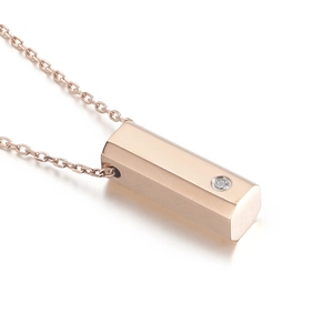 Rose gold stainless steel hexagonal pillar pendant necklace with a single diamond inlay