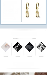 Close-up of gold chain link earrings featuring a stylish U-shape buckle design