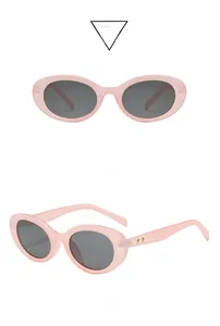 Rosa ovale Sonnenbrille mit grauen Gläsern und goldenem Stern am Bügel, Doppelansicht