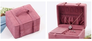 Detailed views showing the open and closed pink velvet travel jewelry box with storage slots