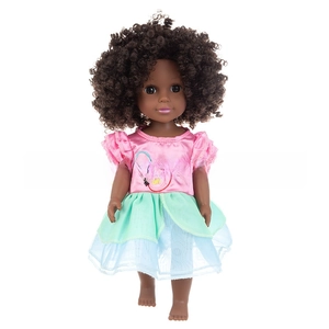 Detail of 14-inch African-American doll with curly hair in a pink top and tutu skirt