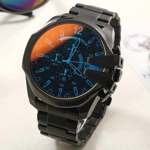 Detail of chronograph watch with gradient crystal lens and black stainless steel band