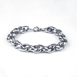 Detailed close-up of a silver stainless steel twisted wheat chain with a lobster clasp