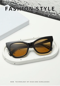 Close-up of black square sunglasses with gradient lenses and YT7776 inner arm printing