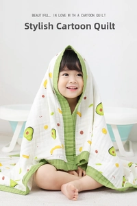 Close-up of baby cotton gauze blanket with cute fruit patterns and soft green edges