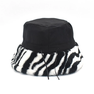Faux fur zebra pattern bucket hat with black crown and adjustable drawstring design