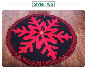 Detail of red and black knitted Christmas tree skirt with snowflake pattern