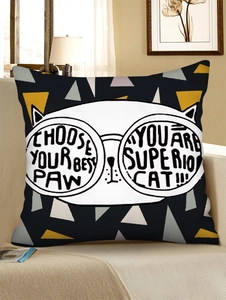 Detailed view of a black linen pillowcase with cat face and geometric patterns on sofa