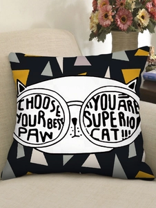 Detail of cartoon cat linen pillowcase with glasses on a beige sofa in cozy home decor