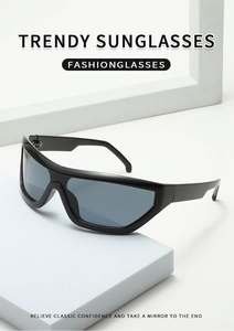 Detail of trendy wraparound cycling sunglasses featuring a sleek black frame and dark lens