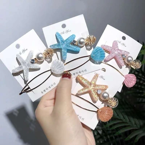 Detailed set of starfish and seashell hair clips with pearls and resin charms