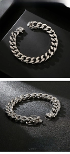 Macro detail showing the brushed finish texture and secure clasp of the Cuban link bracelet