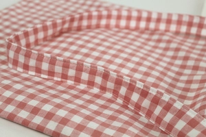 Detailed close-up of pink gingham cotton canvas bag showing precise double-stitch craftsmanship