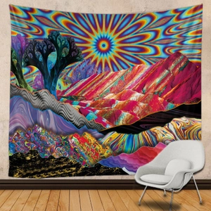 Artistic mandala sun tapestry with colorful mountain landscape hanging in a modern room