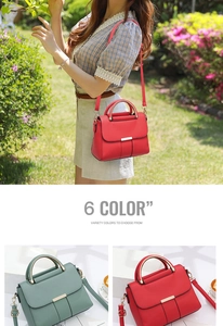 Detail of red and green leather handbags with stylish metal handles and long straps
