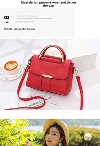 Detail of red PU leather bag featuring metallic handle and golden bar decoration