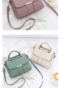 Detailed view of pink, green and beige crossbody handbags with metal buckle accents
