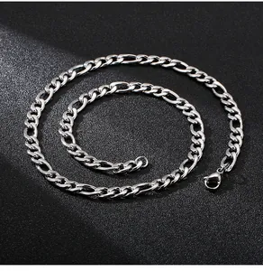 Macro view of silver Figaro chain showing 3+1 link details and lobster clasp closure