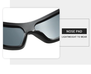 Detail of ergonomic one-piece nose pads on lightweight black oversized cycling sunglasses