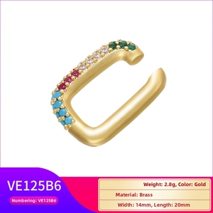 Macro detail of gold plated cuff earring with colored zircons showing 14mm by 20mm size