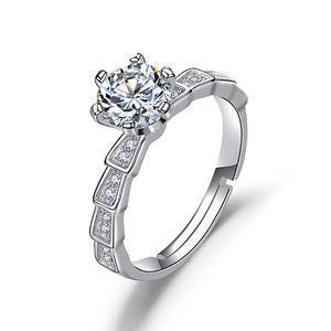 Macro detail of silver six-prong engagement ring with adjustable band and pave zircon stones