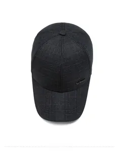 Top view of dark grey men baseball cap showing fine weave texture and metal Sport badge