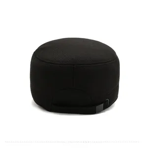 Detail view of the adjustable rear buckle and woven texture of the black military flat cap