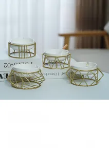 Close-up of geometric ceramic ashtray with luxury gold metal frame for modern home decor
