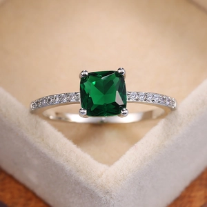 Elegant emerald green cushion cut ring with micro-paved silver band for women