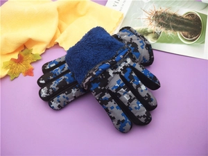 Detail of blue and grey camouflage winter ski gloves with soft fleece cuffs