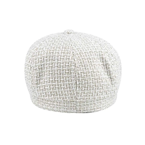 Detailed view of white tweed checkered beret showing thick woven texture and fabric detail