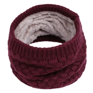 Detail view of burgundy knitted scarf with thick grey fleece lining for winter warmth