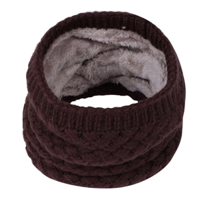 Detail of winter knitted neck warmer showing thick cable knit and soft grey fleece lining