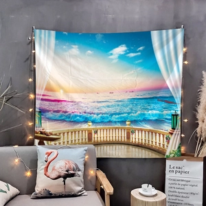 Detail of wall tapestry featuring beach sunset with string lights and flamingo pillow