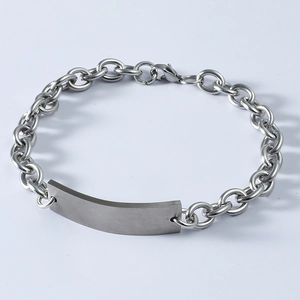 Macro shot of silver curved titanium steel plate with chain and lobster clasp