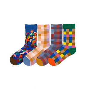 Detail of four cotton crew socks featuring a portrait pattern and colorful plaid designs