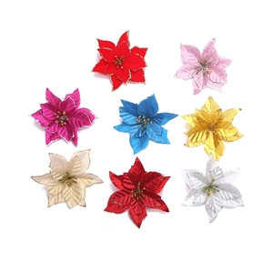 Close-up of artificial Poinsettia flowers in eight glitter colors for Christmas trees