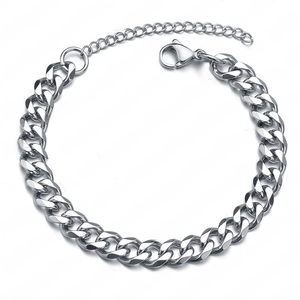 Macro detail of silver stainless steel curb chain bracelet with lobster clasp and extension