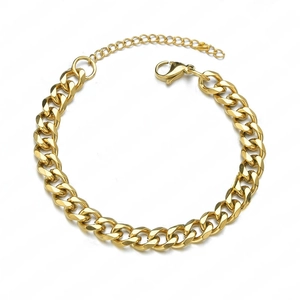 Detail of gold Cuban link bracelet with lobster clasp and adjustable extension chain