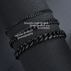 Detailed view of three different widths of black stainless steel cuban curb chain bracelets