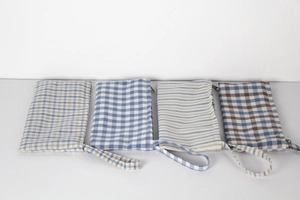 Set of four cotton linen pouches with blue and brown grid patterns and wrist straps